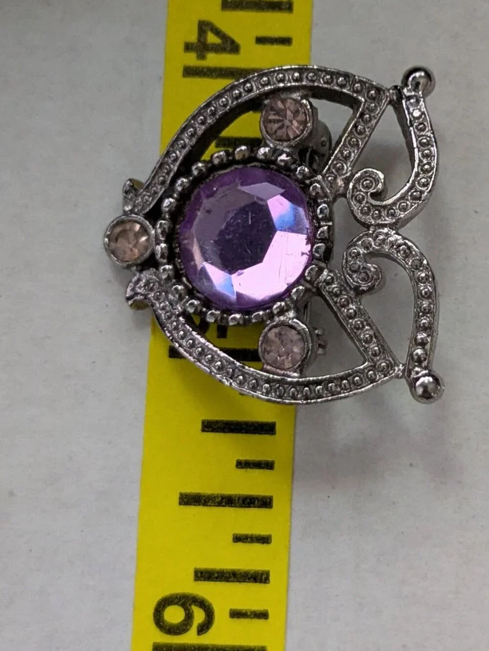 Small Silver Tone Purple Faceted Rhinestone Filigree Brooch Pin